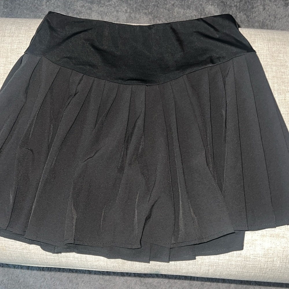 Black Forever 21 mini tennis skirt with under shorts.